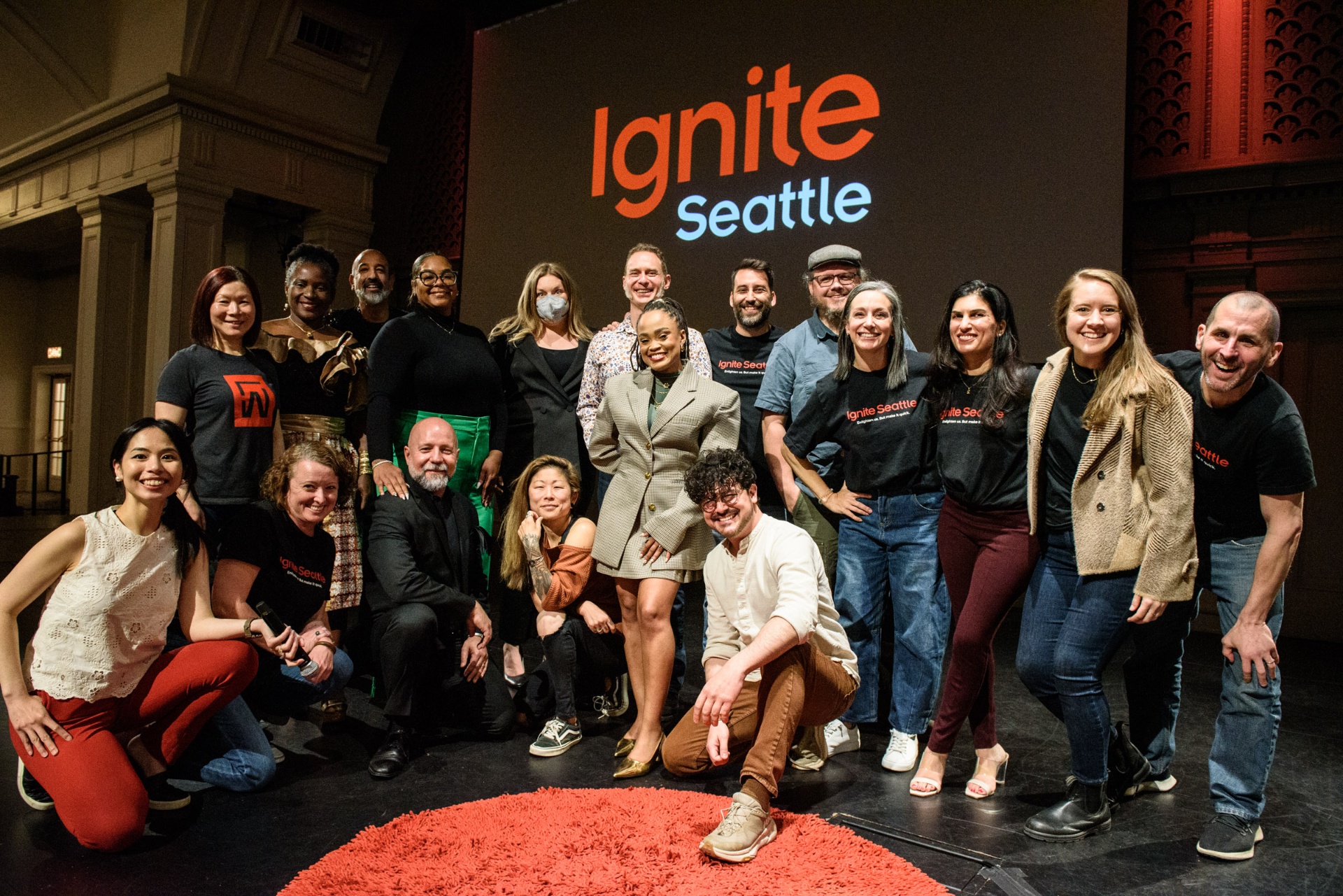 Molly Hawkins with the Ignite Seattle speaker group on stage